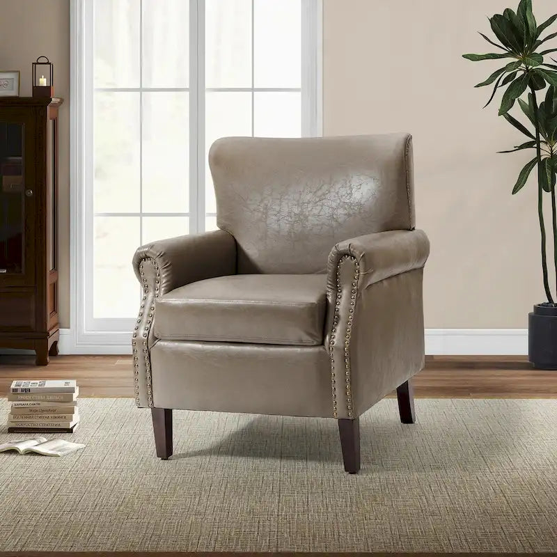 Fauteuil de transition en similicuir végétalien avec accoudoirs roulés et garniture cloutée